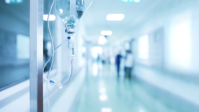 Medical drip in hospital corridor, concept of treatment