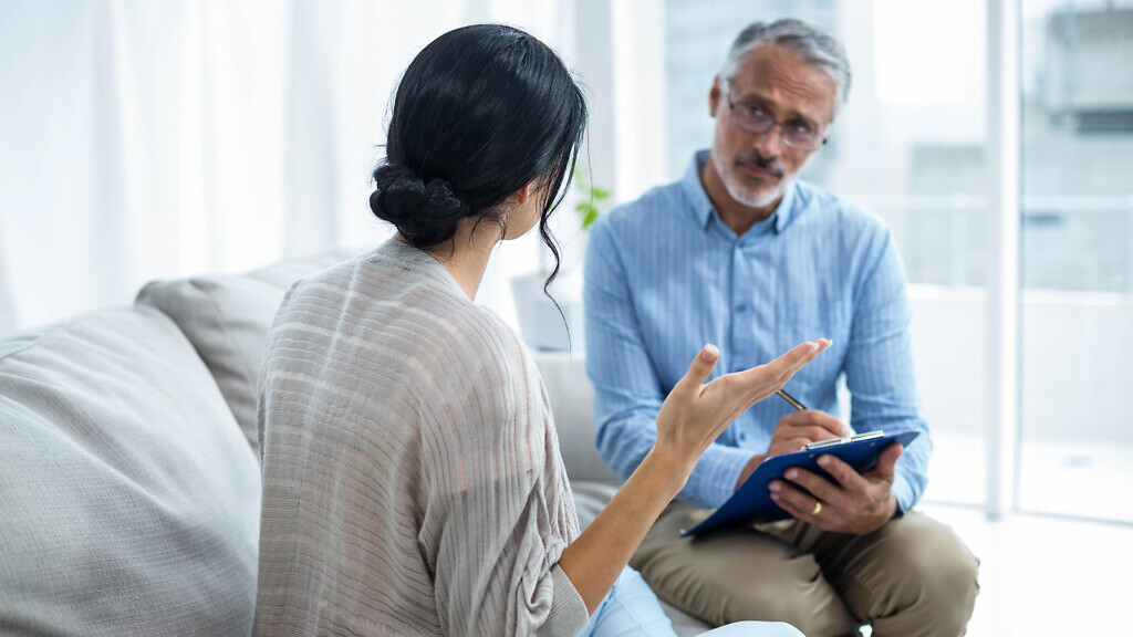 Therapist consoling a woman