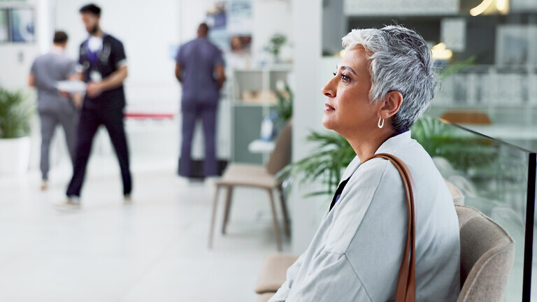 Thinking, waiting and senior woman in hospital, medical and calm with healthcare. Thoughts, mature person and lady in clinic, anxiety and wonder with decision, choice and peace with break.