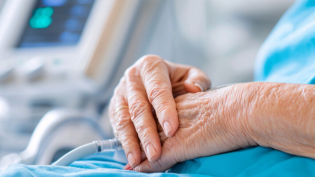 Kidney failure concept. Elderly hands resting on a lap