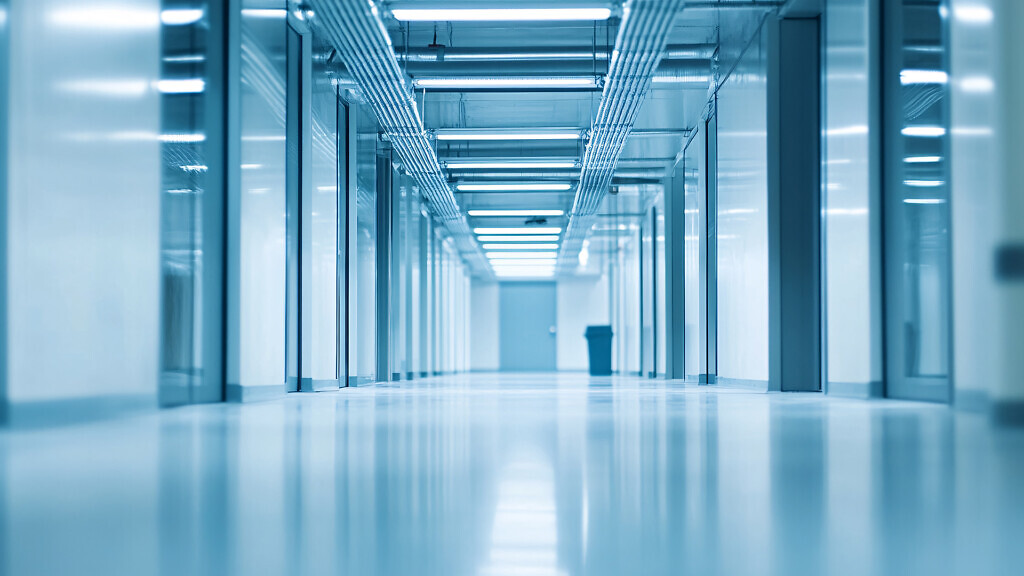A long exposure shot of a modern, sterile hallway.