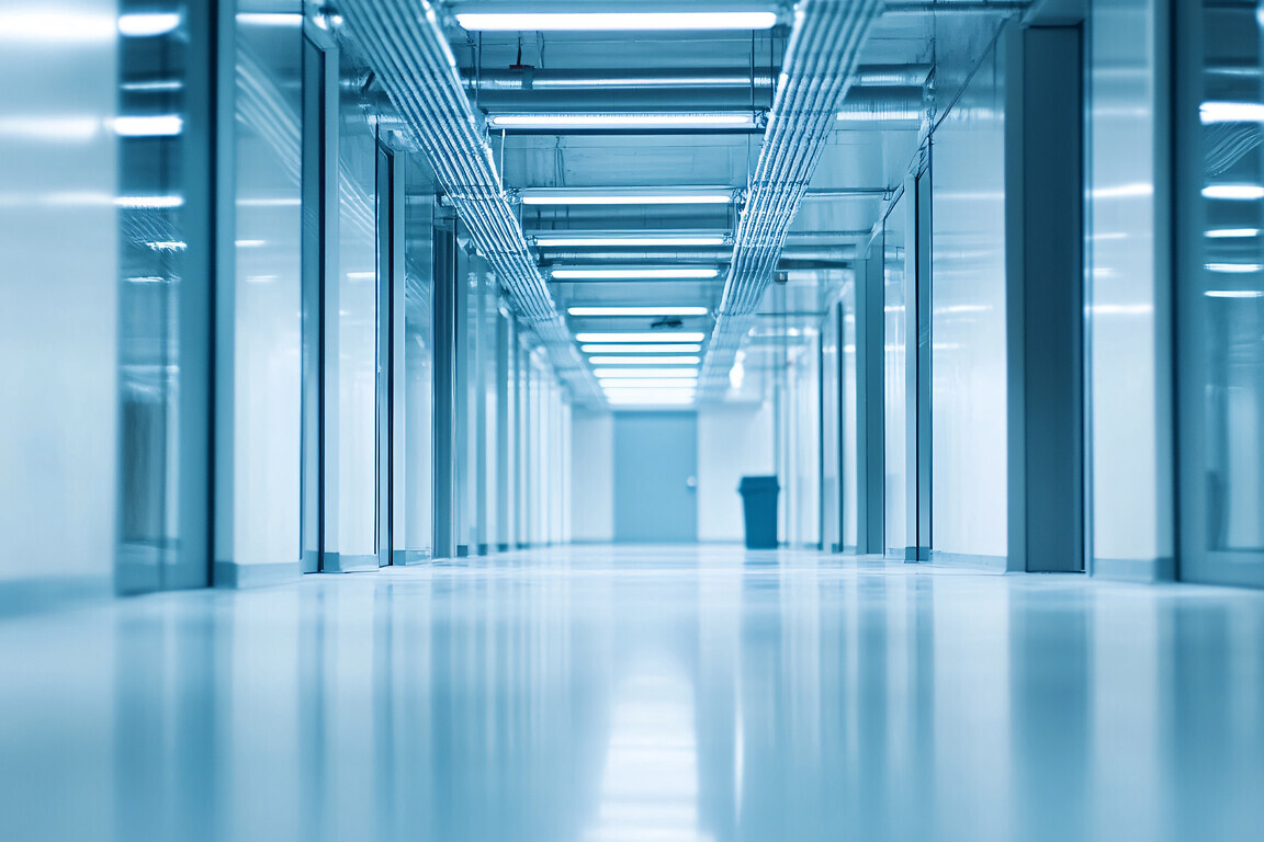 A long exposure shot of a modern, sterile hallway.