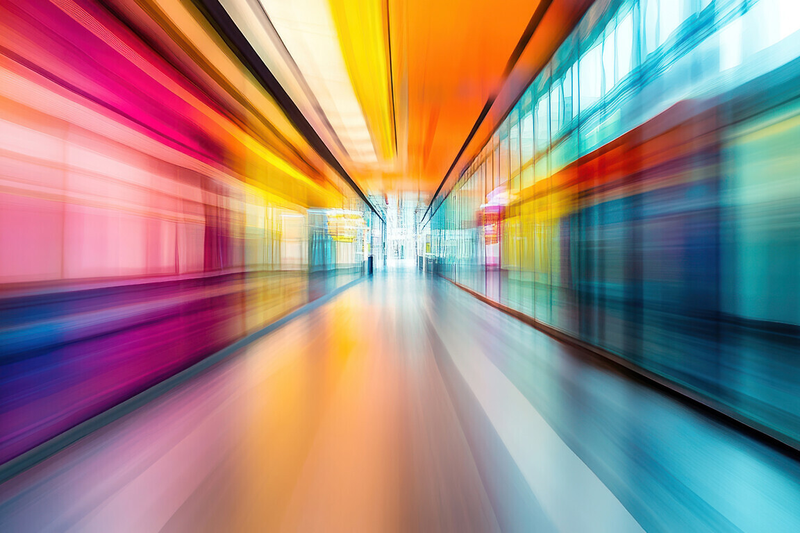 An abstract motion-blurred hospital corridor with a modern design and vibrant energy