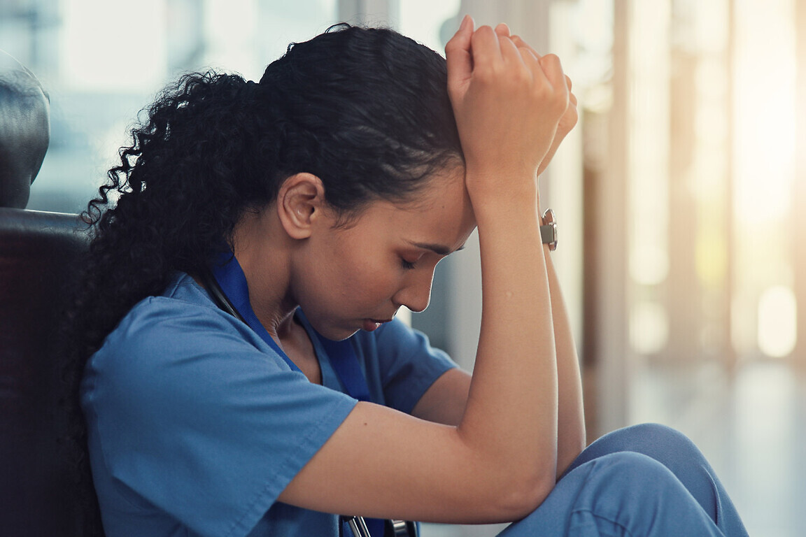 Nurse, stress and woman with grief, anxiety and patient loss or bad news and overwhelmed in clinic. Mental health, sad and surgeon student with panic attack, healthcare fail or medical burnout