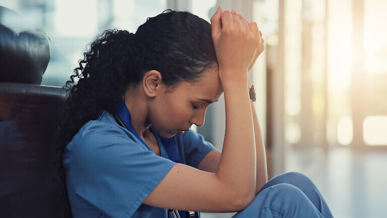 Nurse, stress and woman with grief, anxiety and patient loss or bad news and overwhelmed in clinic. Mental health, sad and surgeon student with panic attack, healthcare fail or medical burnout