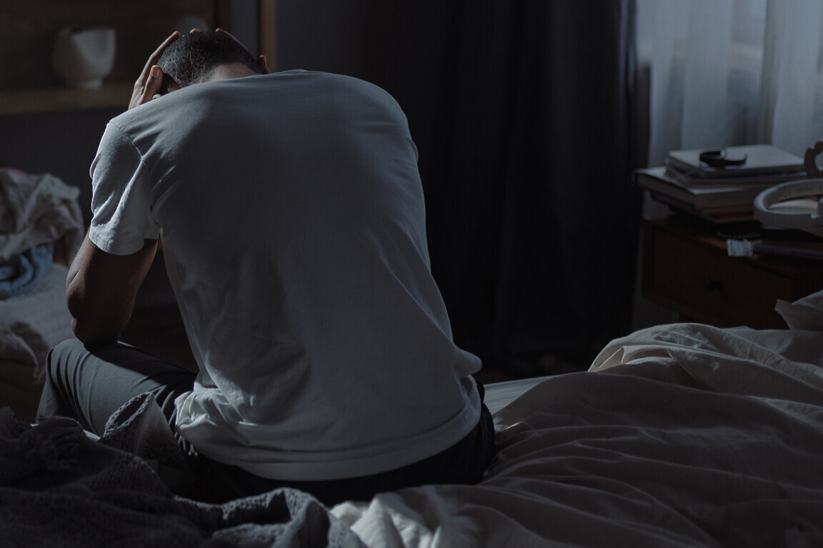 African American man embodies emotional struggle with deep despa