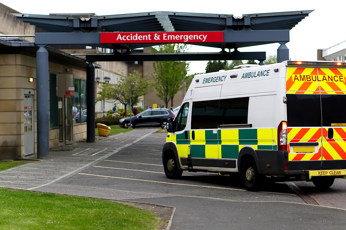 An ambulance drives into an Accident & Emergency ward of a hospi