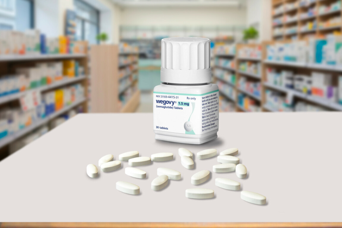 Medicine container bottle with weight-loss drug Wegovy tablet pills from Novo Nordisk inside a blurred pharmacy.