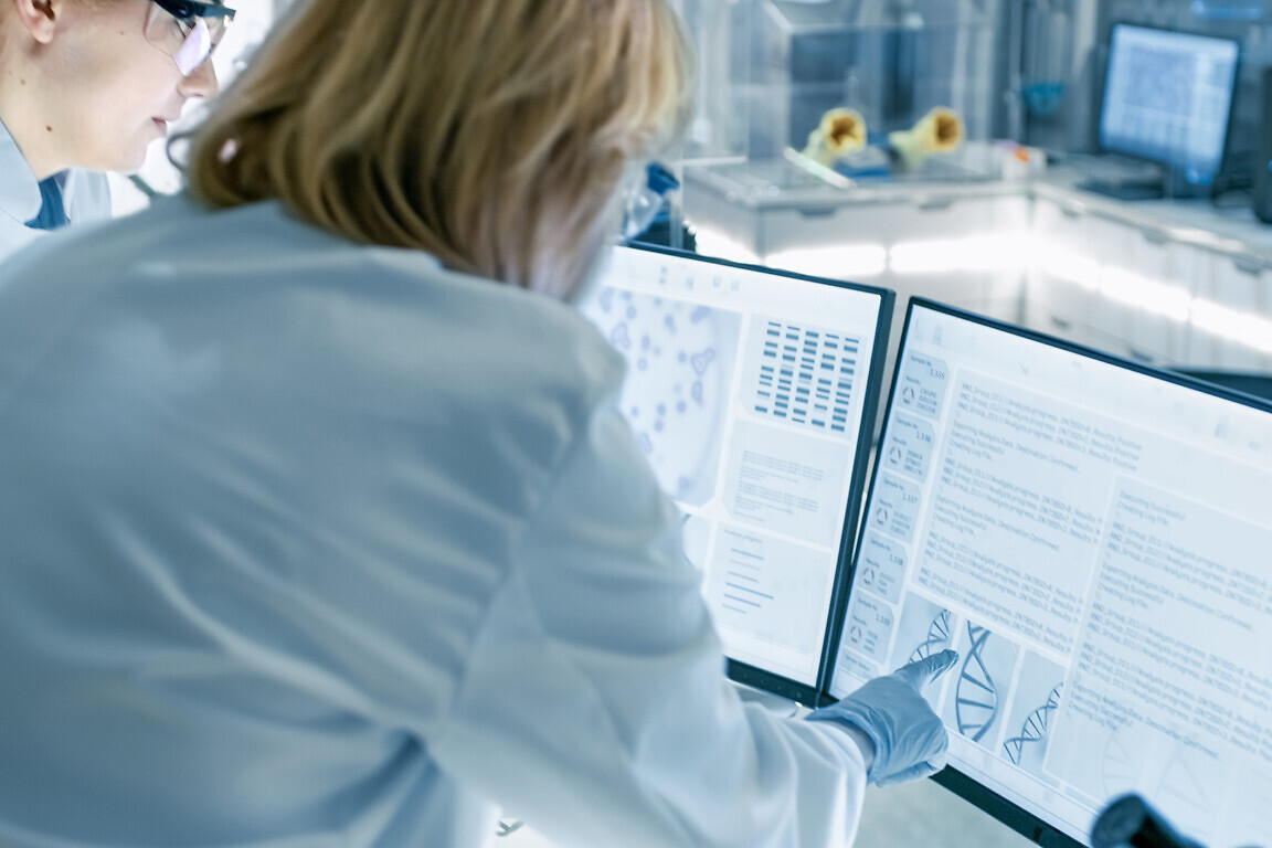 Senior Female Scientist Discusses Scientific Data
