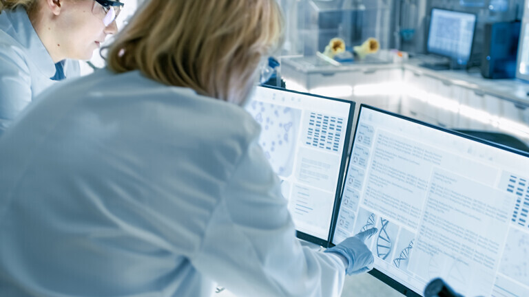 Senior Female Scientist Discusses Scientific Data