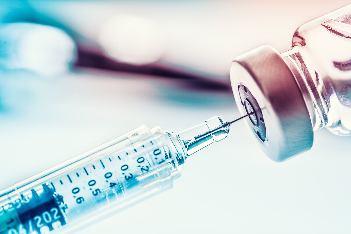 Close-up medical syringe with a vaccine.