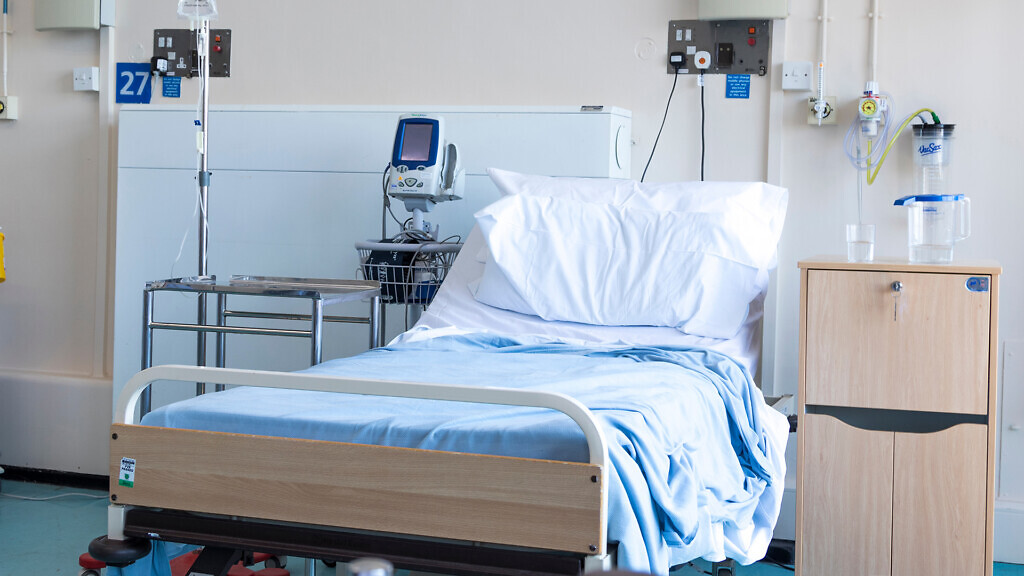 Empty bed in a hospital ward