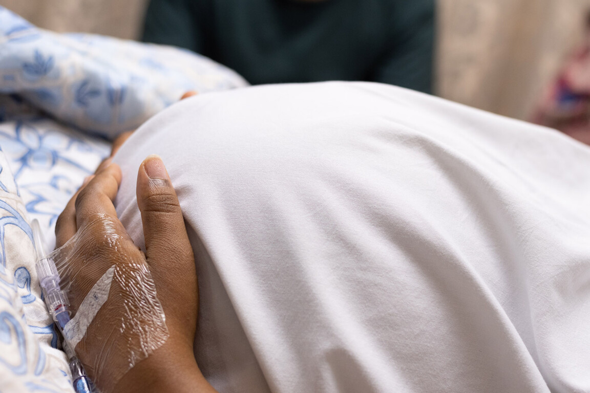 pregnant woman lying in a hospital bed