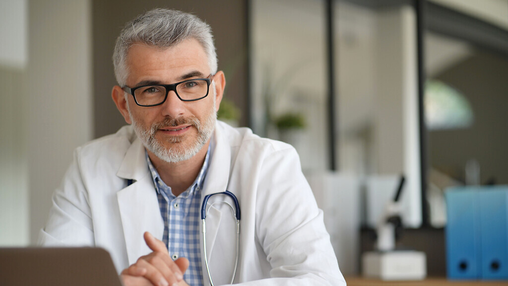 Portrait of confident doctor in private clinic