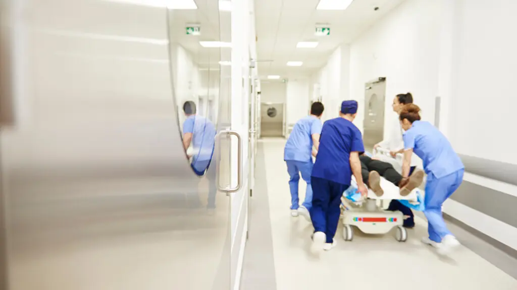 Team of doctors running in a hurry