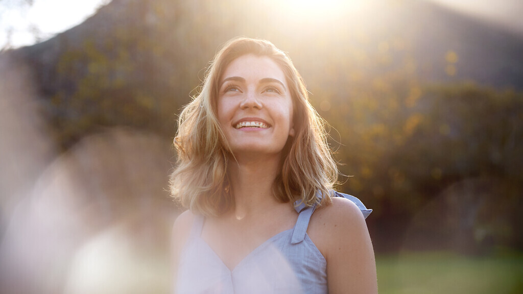 happy sunrise woman with beautiful smile full of optimism