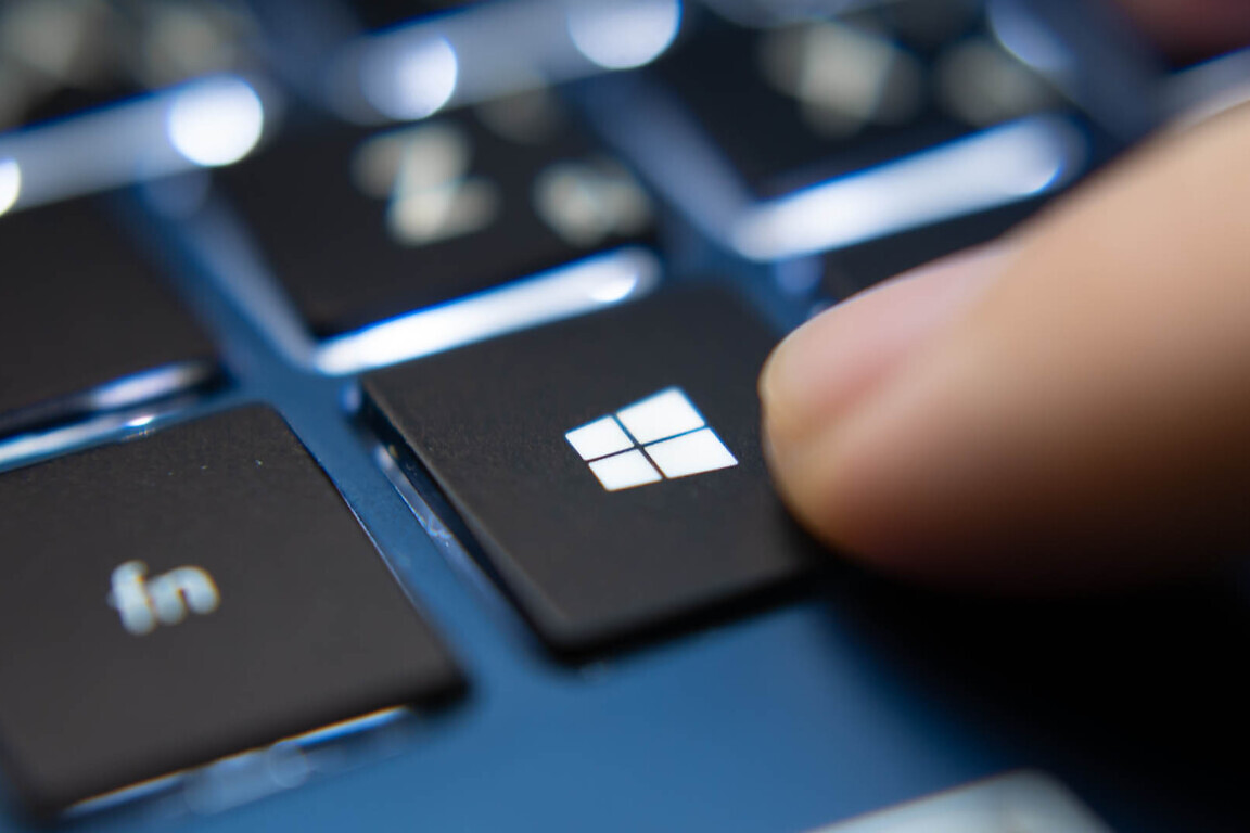 Laptop user pressing Windows