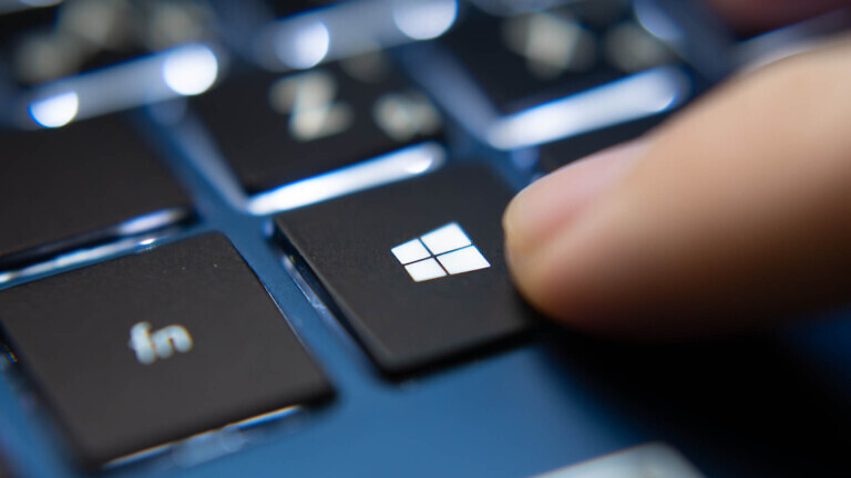Laptop user pressing Windows