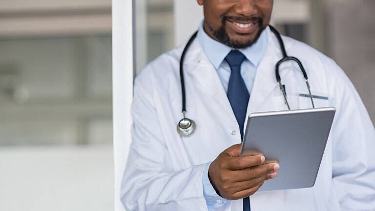 Doctor reading medical report