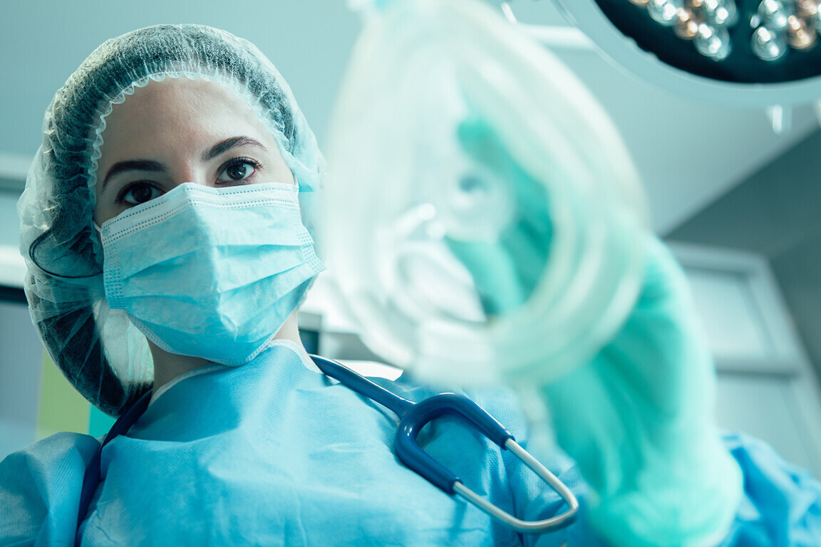 Experienced anesthesiologist doing her work stock photo