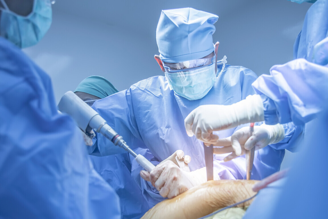 Team of doctor doing surgery inside modern operating room