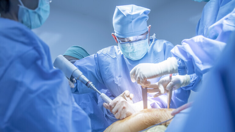 Team of doctor doing surgery inside modern operating room
