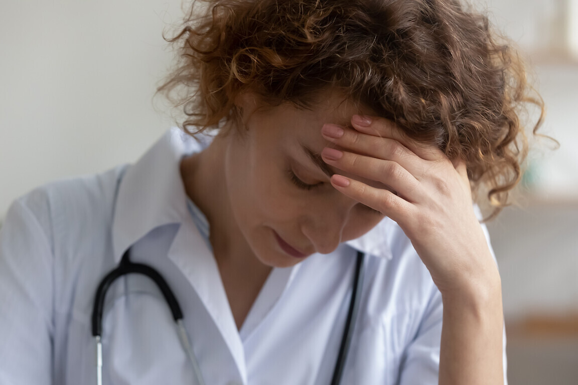 Unhappy female doctor feel stressed at workplace