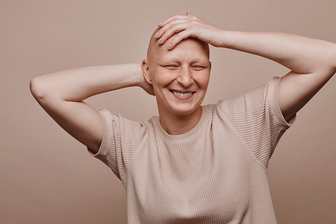 Carefree Bald Woman in Studio