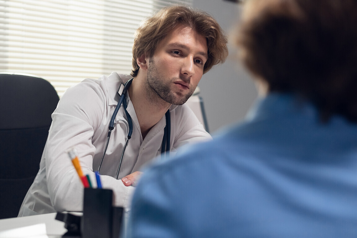 Healthcare and medicine concept - a doctor with his patient in a consultation room
