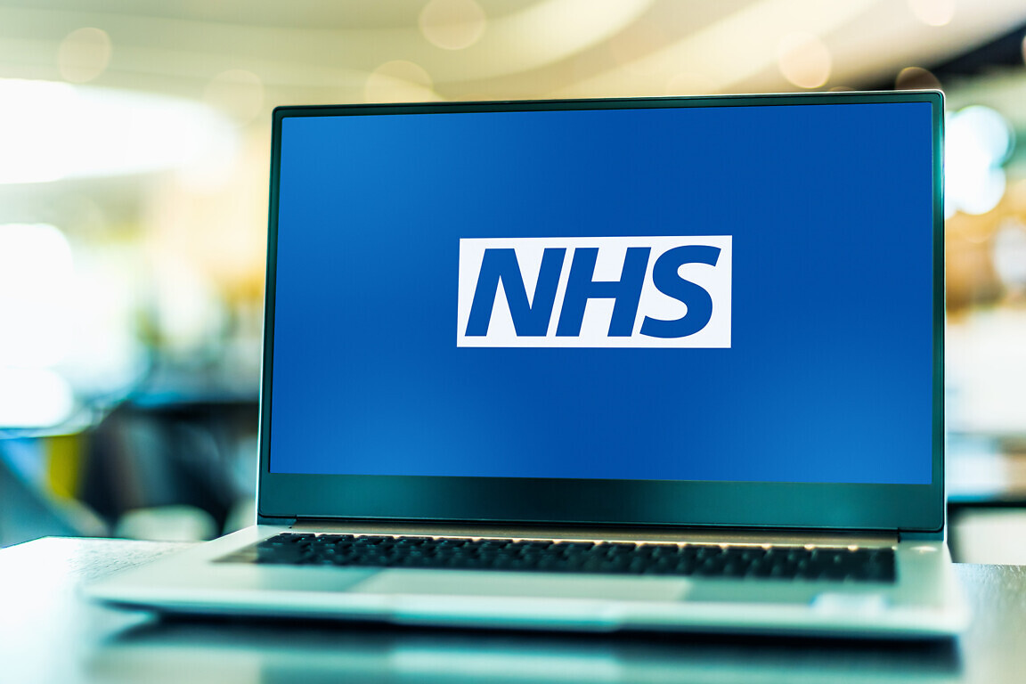 Laptop computer displaying logo of The National Health Service