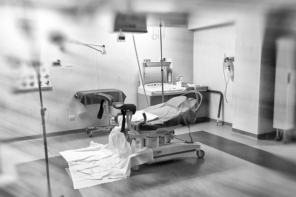 View of an empty hospital bed in the maternity ward at a hospital.