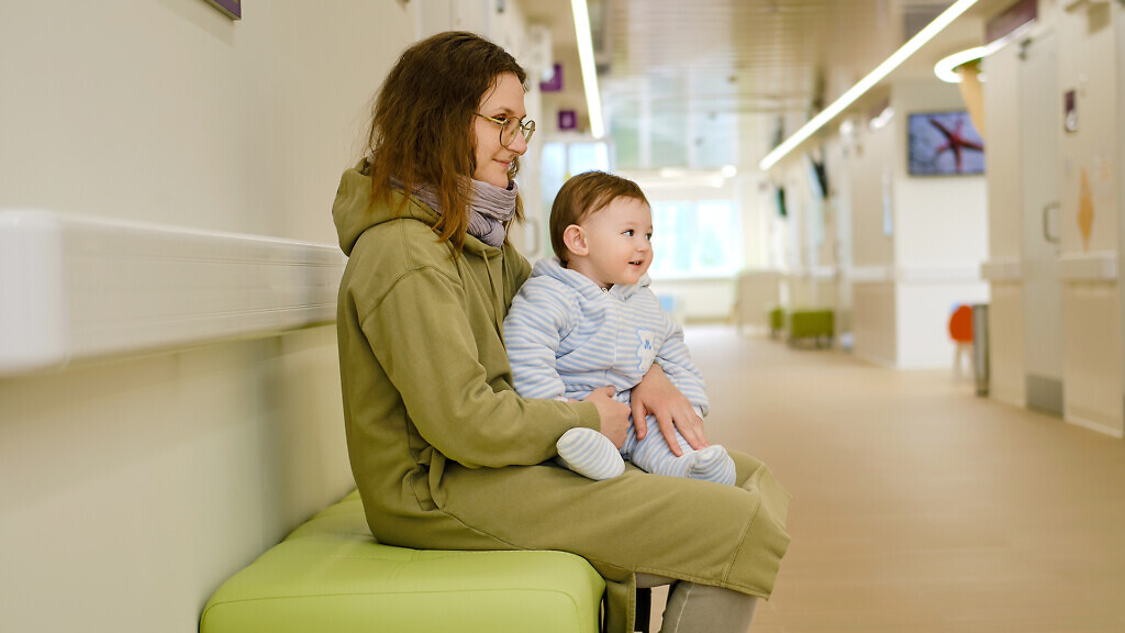Children sitting in waiting room at hospital.