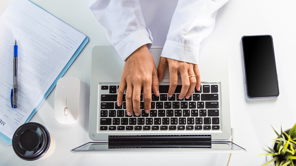 Nurse working using computer browsing internet, Closeup hands female doctor wear uniform in hospital she typing information on keyboard laptop, Healthcare medical health website technology online data