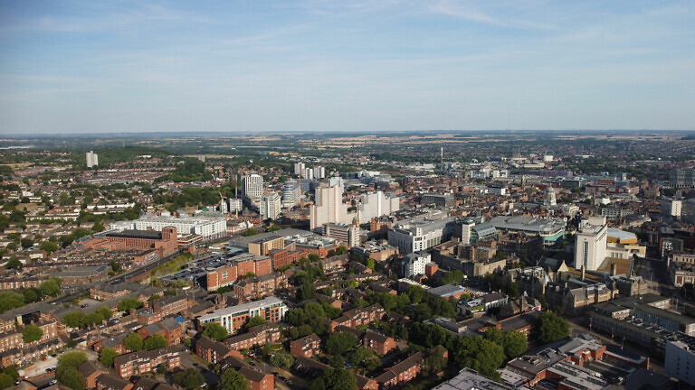 Aerial shot of the city streets with residential buildings