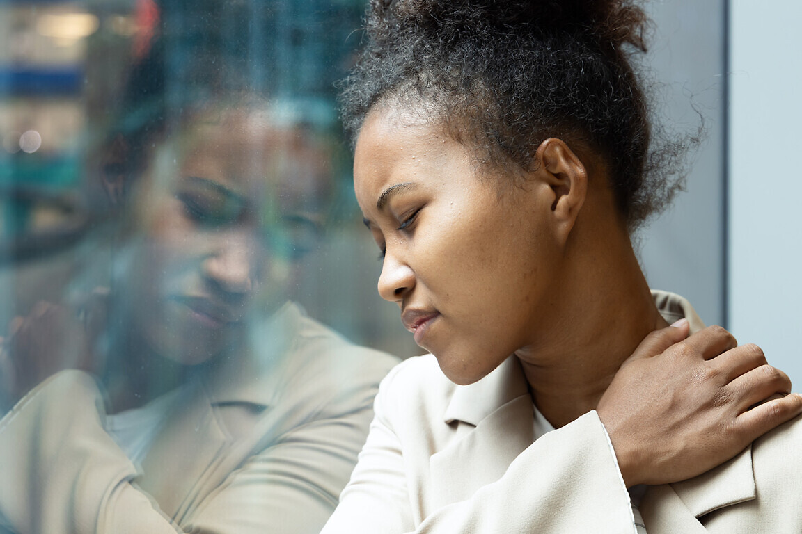 Office worker woman having shoulder sickness or neck pain from overwork or office syndrome