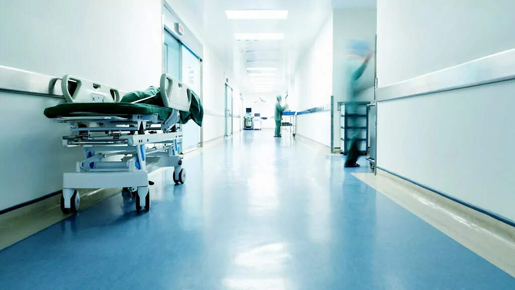 Doctors and nurses walking in the hospital hallway