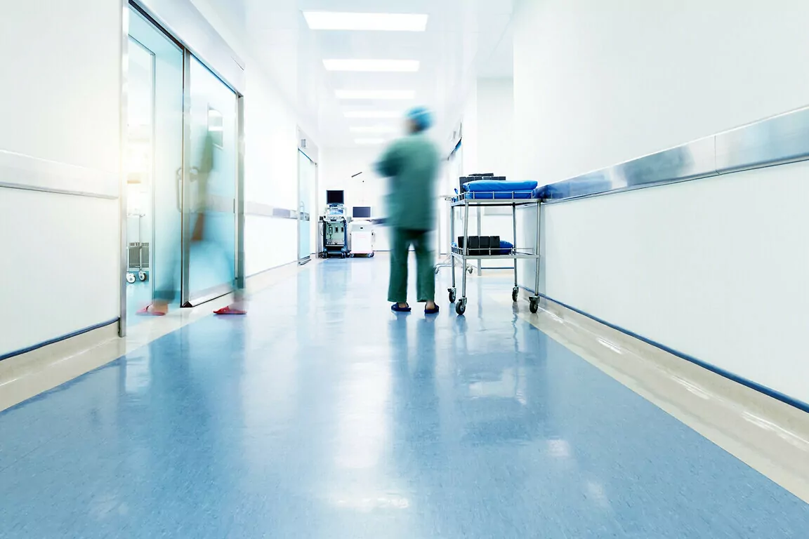 Doctors and nurses walking in the hospital hallway