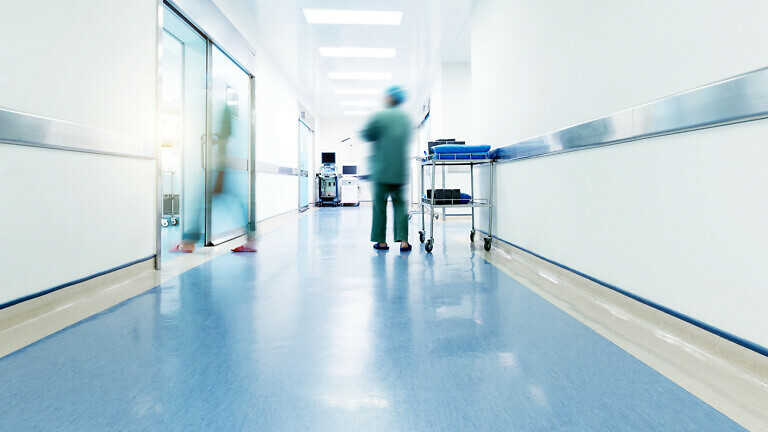 Doctors and nurses walking in the hospital hallway