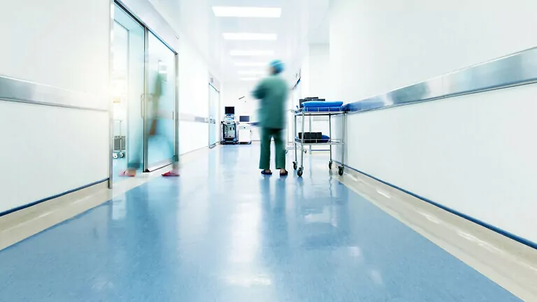 Doctors and nurses walking in the hospital hallway