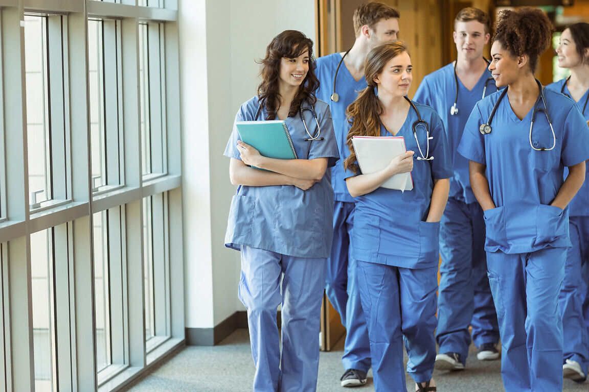 Medical students walking through corridor