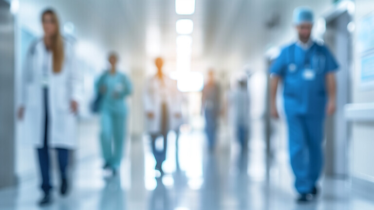 blurred medical personnel: silhouettes of doctors and nurses