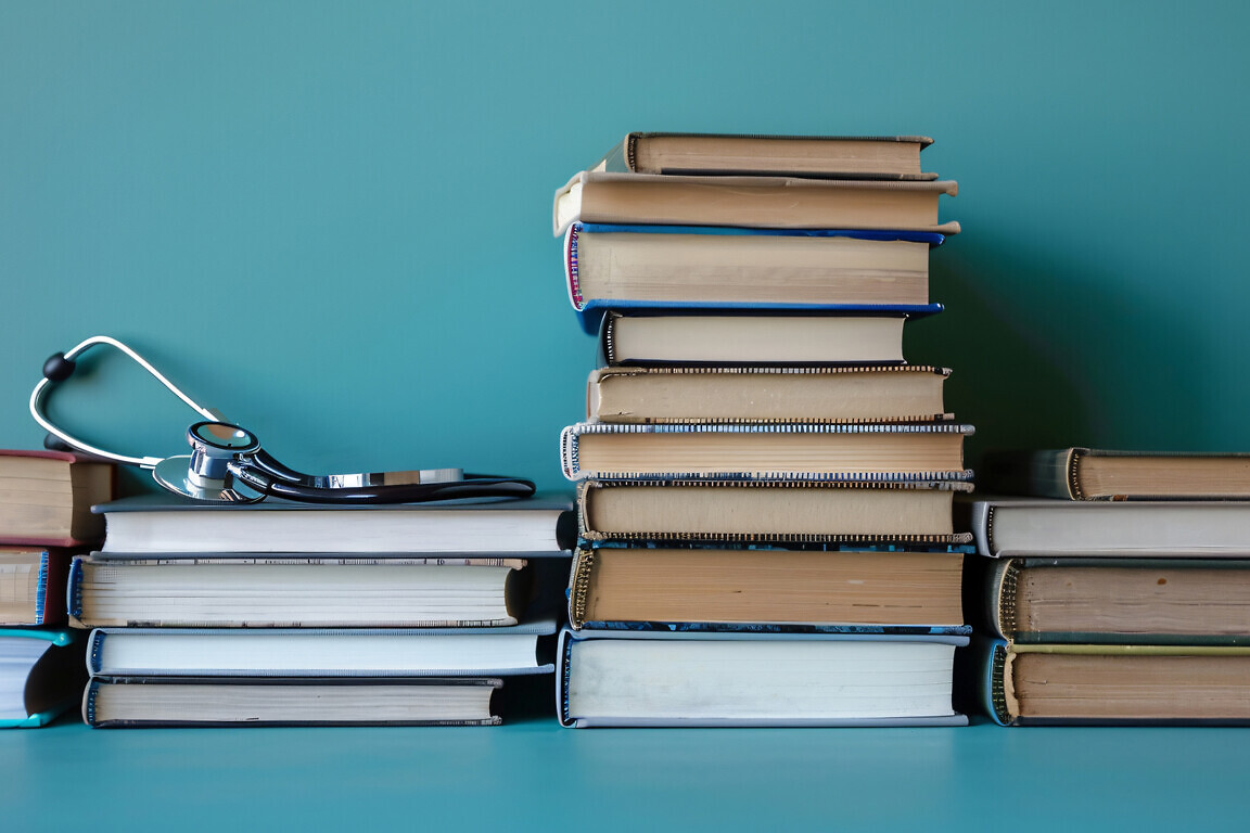 Stacked medical books and journals forming a knowledgeable frame