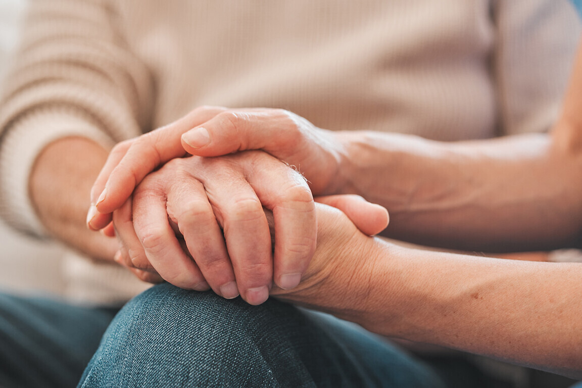 Holding hands, support and nurse with patient for medical diagnosis at consultation with comfort. Healthcare, empathy and caregiver with person for compassion, kindness or hope with bad news