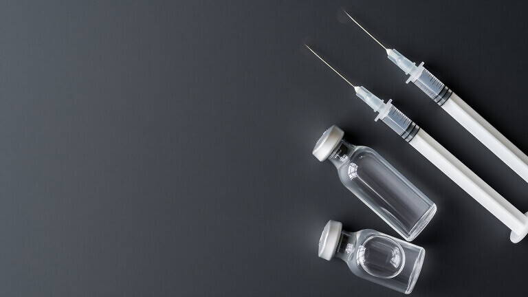 Background with syringe and medicine.