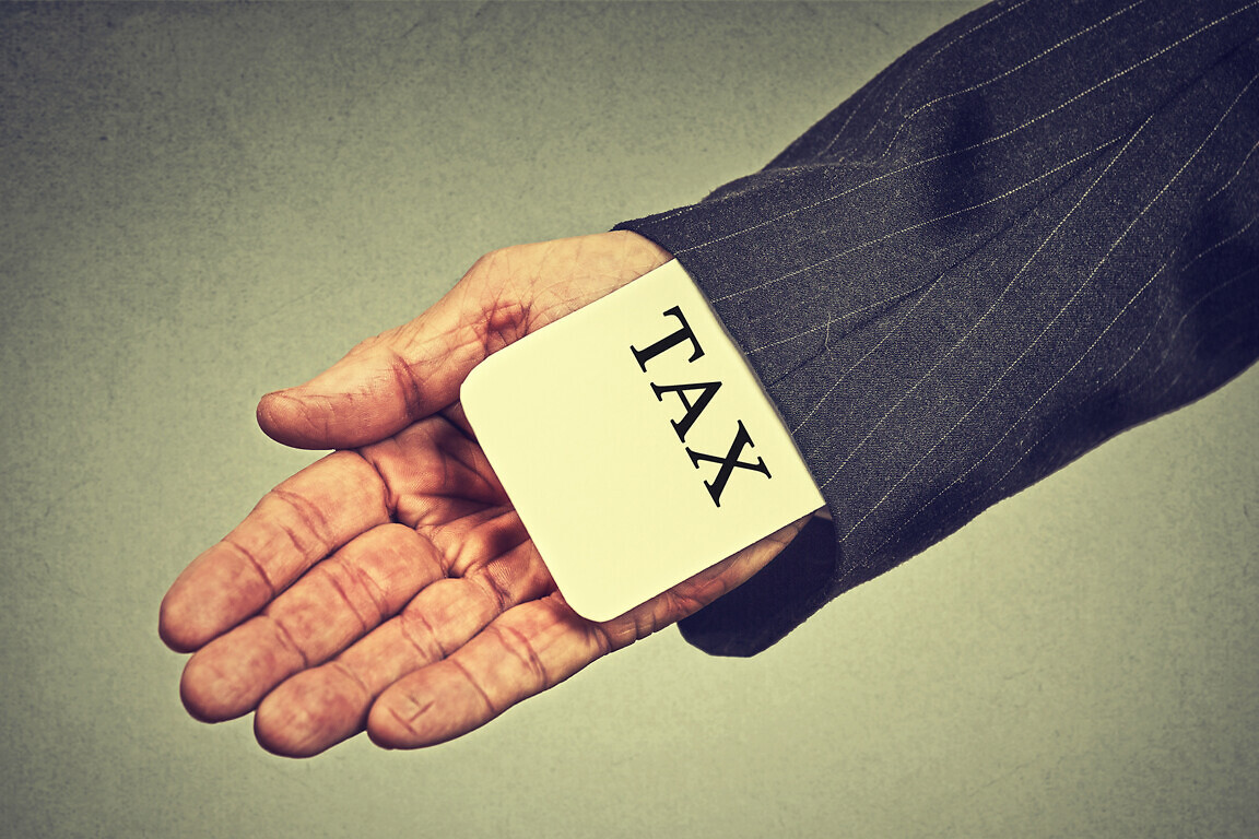 man hand hiding tax card