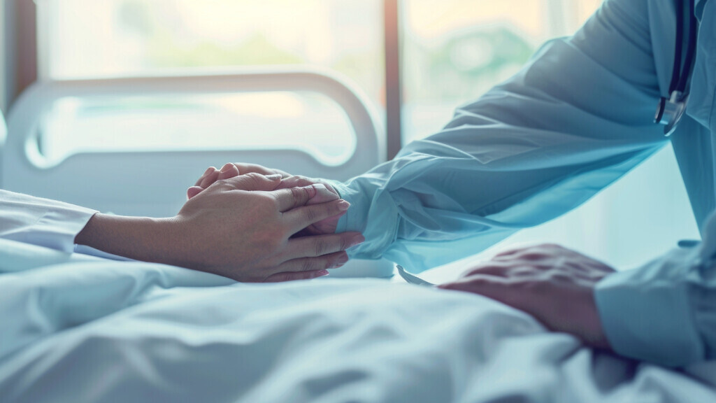 A doctor comforts a patient in a warmly lit hospital room. The s