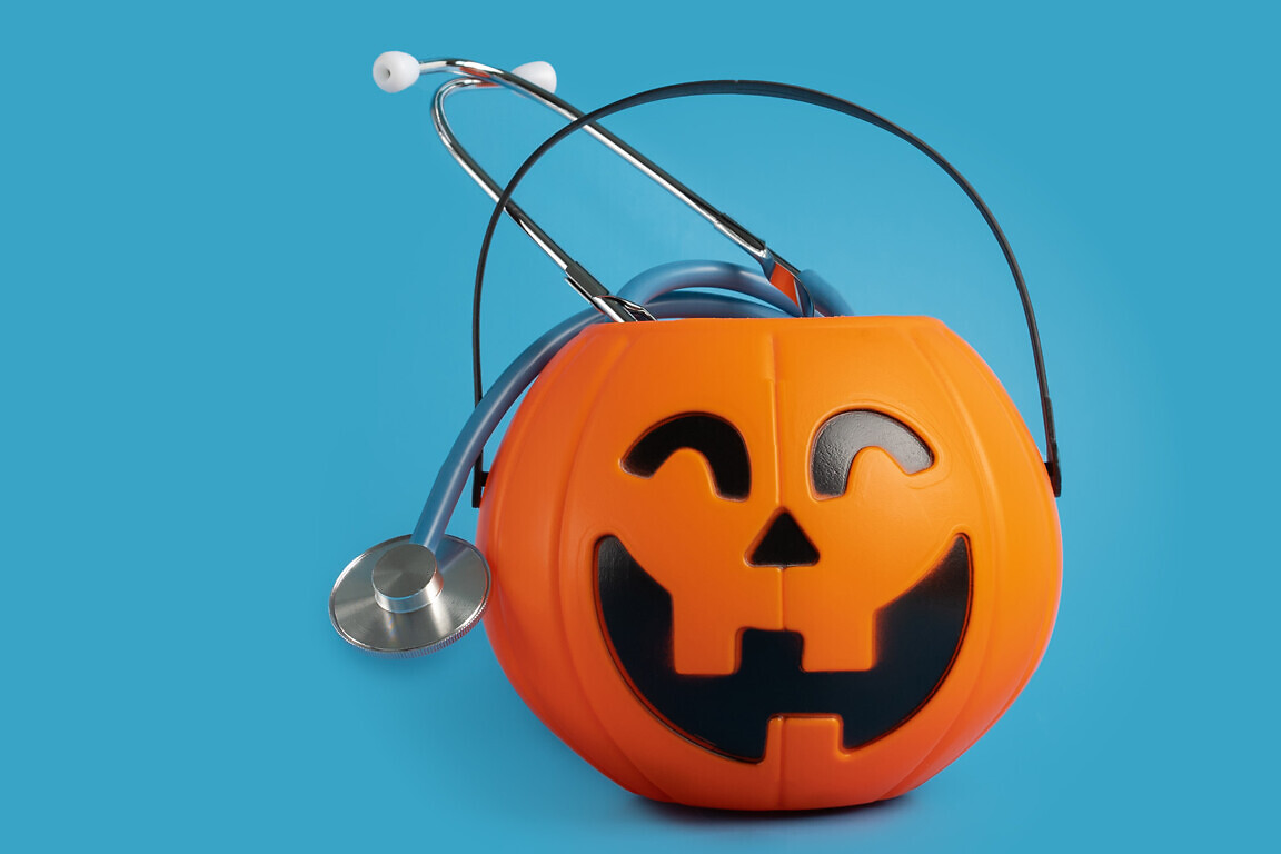 halloween medical healthcare,stethoscope in a pumpkin candy bowl, seasonal discounts for doctors in hospitals and clinics, autumn examinations, holiday promotions
