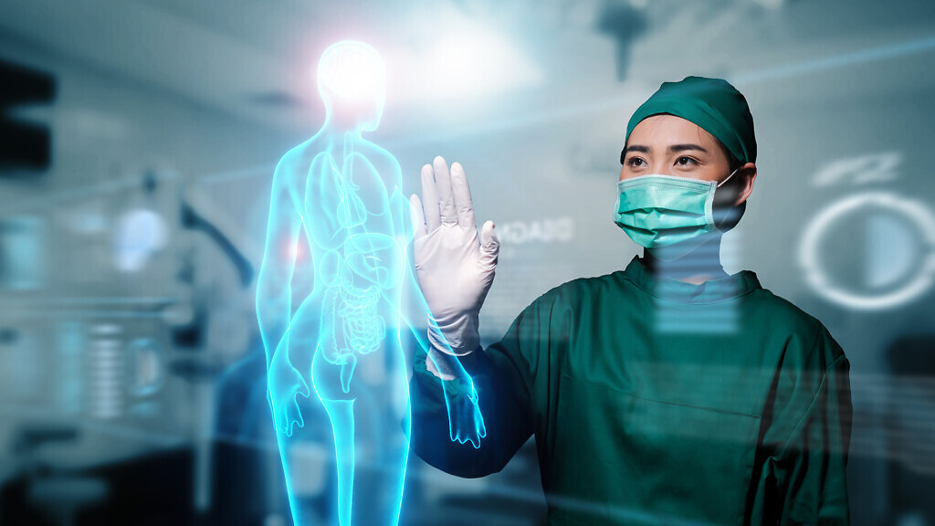 Asian female doctor specialist surgeon using computer human body