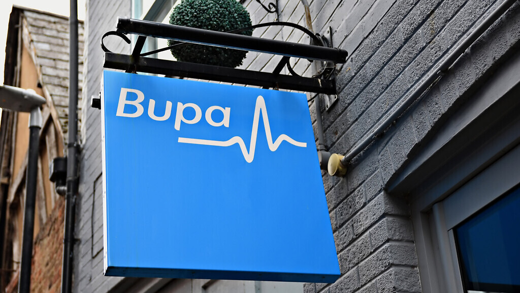 Close up of a blue Bupa sign.
